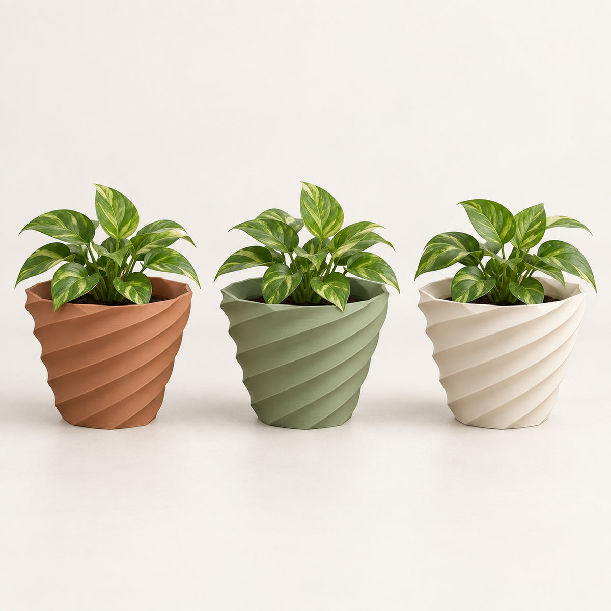 Maceta Twist 3D en colores terracota, verde salvia y marfil